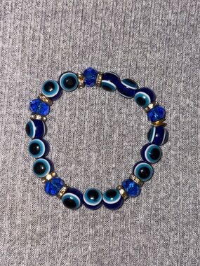 Evil eye & blue beaded stretch bracelet w gold tone rhinestone embedded spacers